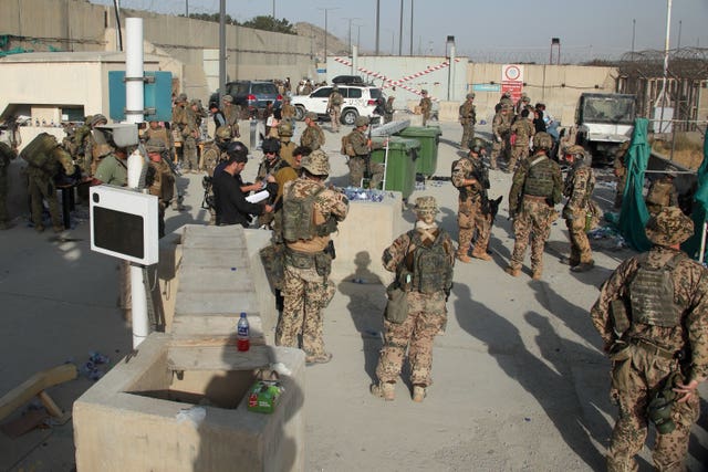 British and US military assist in evacuating people from Kabul