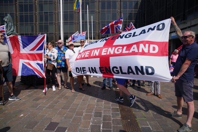 Holding a large flag of St George 