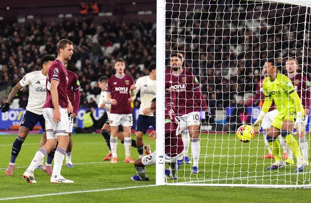 Nicolas Dominguez, background, turns away in celebration after scoring Nottingham Forest’s equaliser