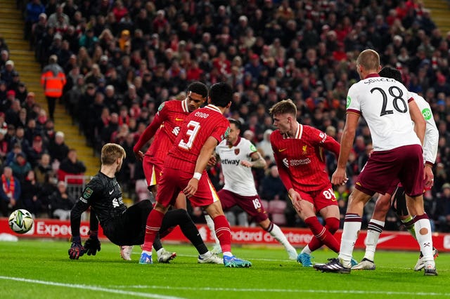 Liverpool defender Jarell Quansah, second left, scores an own goal