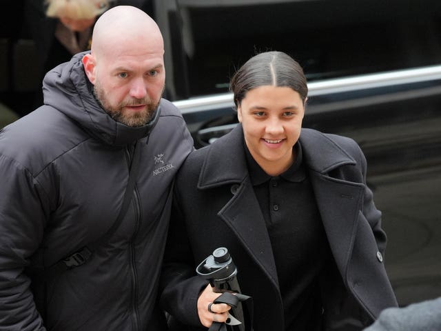 Sam Kerr and a male bodyguard