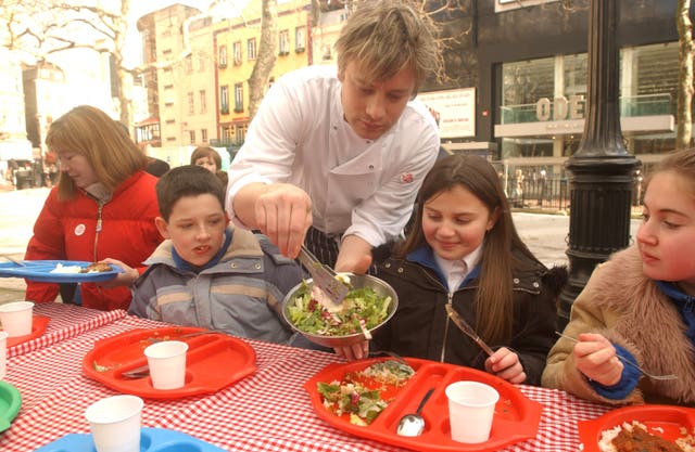 Jamie Oliver serves dinners to children – Leicester Square
