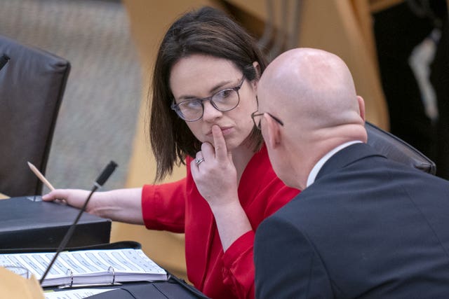 Kate Forbes in Parliament, with John Swinney next to her