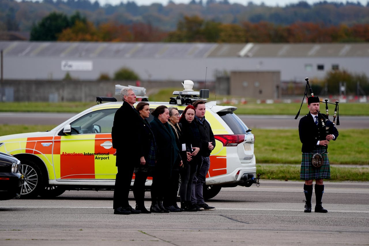 Plane carrying body of former first minister Alex Salmond lands in