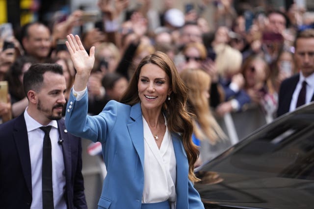 The princess waves at well-wishers during her trip to Italy
