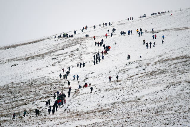 People walking on Pen y Fan in the Bannau Brycheiniog National Park 