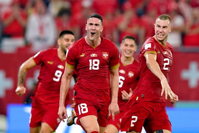 Serbia''s Dusan Vlahovic (centre) celebrates