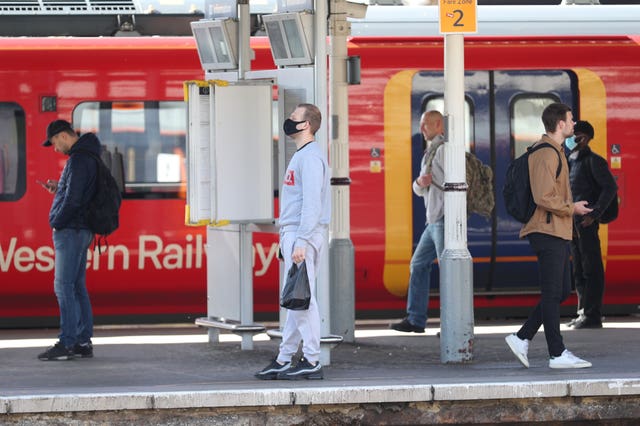 Passengers try to observe social distancing at Clapham Junction station