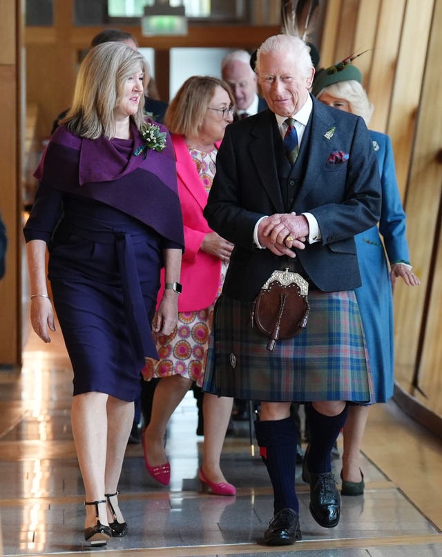 King Charles dressed in a kilt during a visit to the Scottish Parliament in Edinburgh