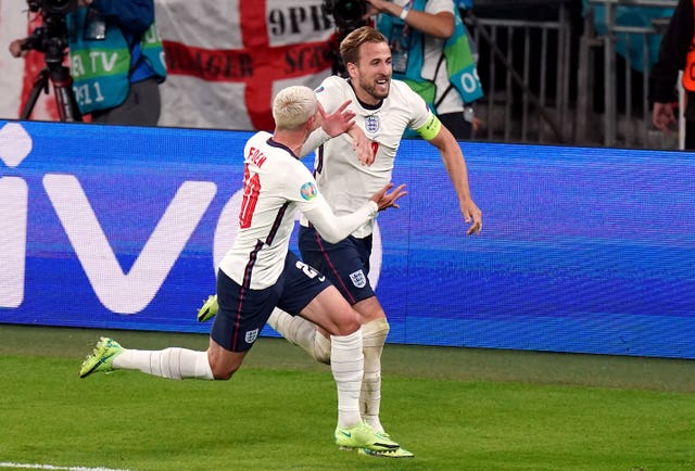 Harry Kane celebrates the goal which took England into the final of Euro 2020 courtesy of a 2-1 win over Denmark with Phil Foden