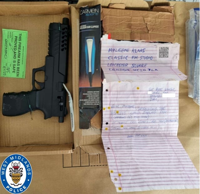 A firearm alongside clippers and a letter