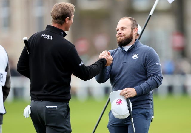 Nicolas Colsaerts and Tyrrell Hatton shake hands