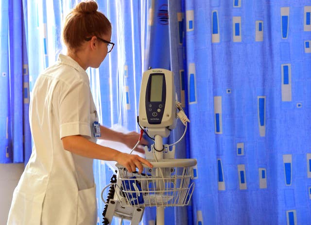 A medical worker with hospital equipment