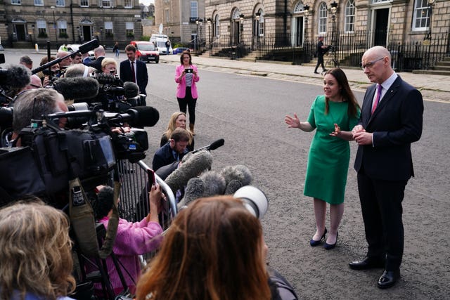 Kate Forbes and John Swinney speaking to journalists