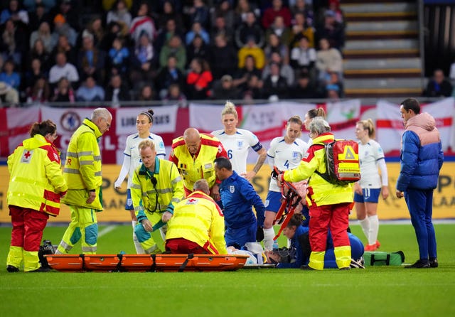 Alex Greenwood receives oxygen during treatment for a head injury