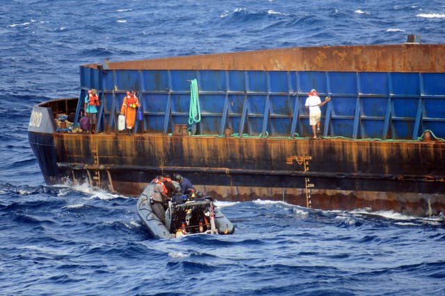 HMS Medway rescuing the crew of the tug