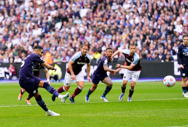 Manchester City’s Riyad Mahrez sees his penalty saved
