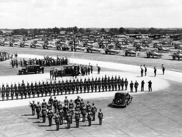 The Guard of Honour saluting King George V on his arrival at Mildenhall, Suffolk, for the Silver Jubilee Review of the Royal Air Force in 1935 (Air Historical Branch/RAF/PA)