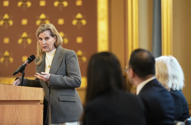 The duchess speaking at a podium during the engagement on Wednesday