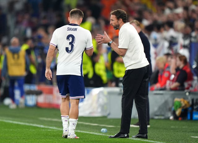 England manager Gareth Southgate (right) addresses Luke Shaw