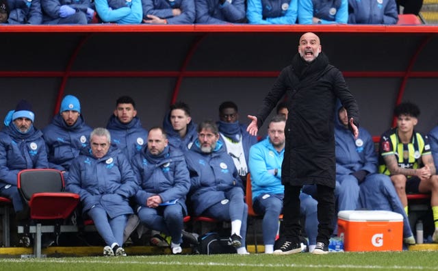 Pep Guardiola shouts on the touchline