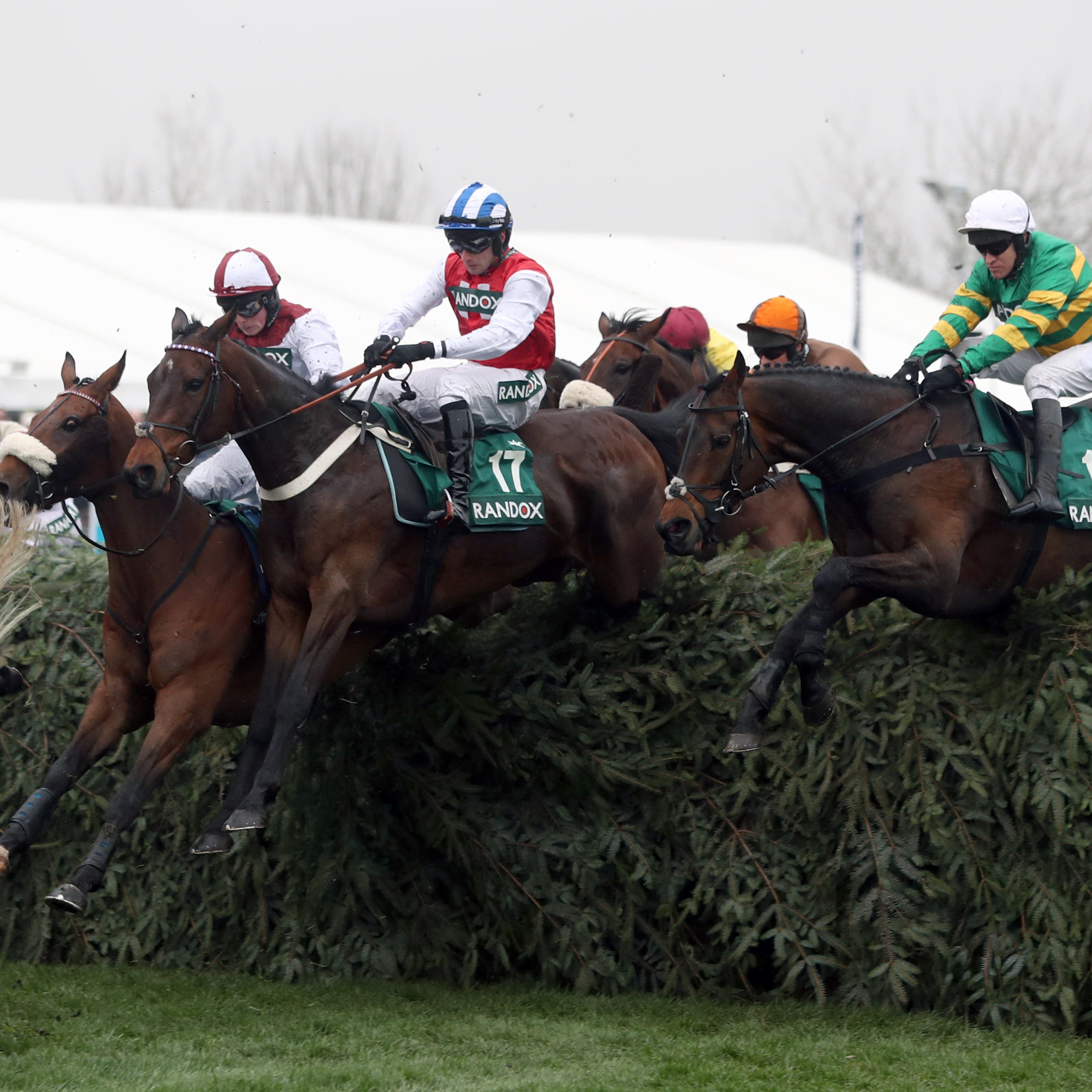 Horses take a fence in the Topham Chase which is the target for Ross O'Sullivan's Call It Magic