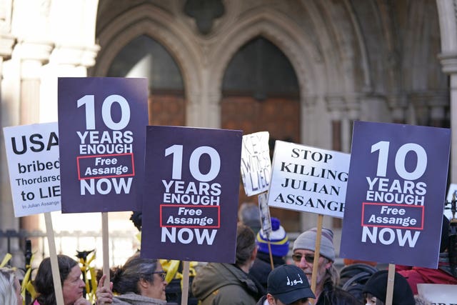 Supporters of Julian Assange demonstrate outside the Royal Courts of Justice