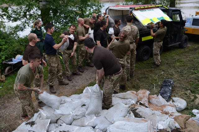 Members of the military helping