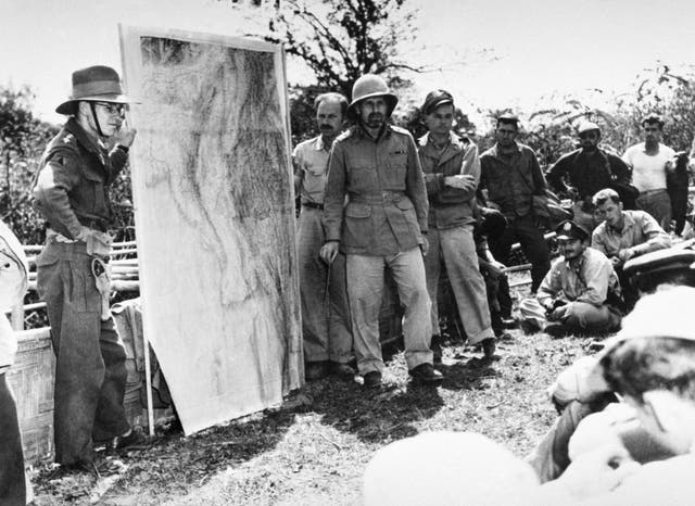 General Orde Wingate (wearing pith helmet), commander of the Chindits, briefs members of the 1st Air Commando, USAAF