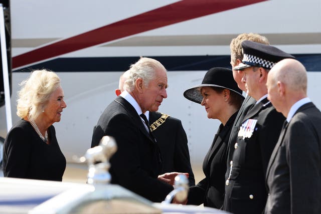 Meeting the King and Queen Consort as they arrive at Edinburgh Airport after travelling from London, ahead of joining the procession of the Queen's coffin from the Palace of Holyroodhouse to St Giles’ Cathedral (PA)