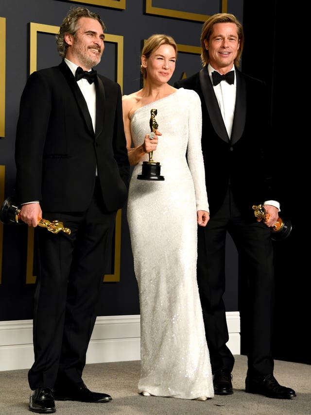 Joaquin Phoenix, winner of the best actor Oscar, Renee Zellweger, winner of best actress, and Brad Pitt, winner of best supporting actor in the press room at the 92nd Academy Awards held at the Dolby Theatre in Hollywood, Los Angeles 