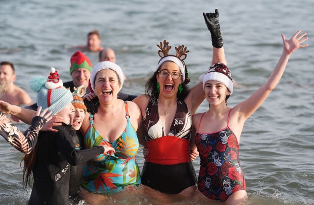 Swimmers take part in the annual New Year’s Day charity swim on Bray seafront in County Wicklow
