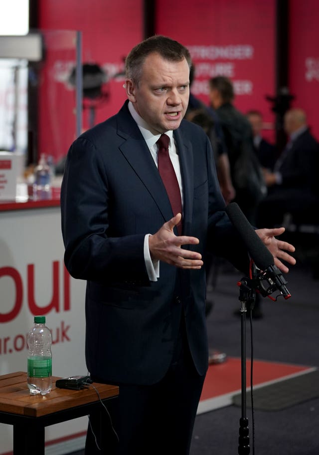 Nick Thomas-Symonds speaking at a microphone