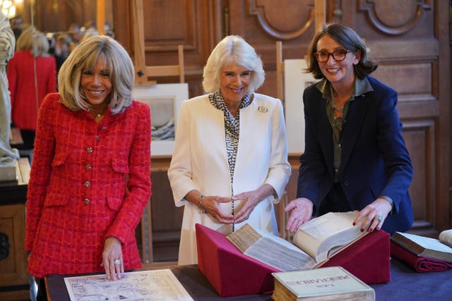 Queen Camilla and Brigitte Macron with president of the French National Library Laurence Engel (right), during a visit to the Bibliotheque Nationale de France in Paris