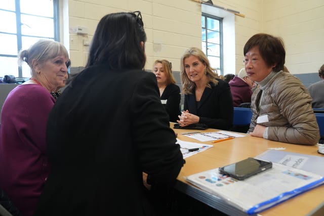 The Duchess of Edinburgh sits around a table during a visit to the English for Women Project on Thursday 