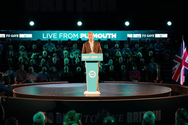 Nigel Farage on a lectern 