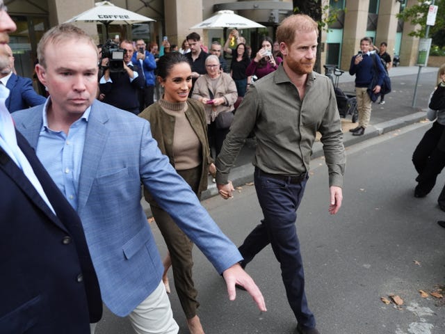 The Sussexes, accompanied by their security, leave the Australian National Veterans Arts Museum (Anvam) in Southbank, Melbourne, Victoria in April 2026