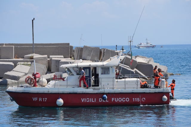 A fire service dive boat with the body of Hannah Lynch returns to Porticello harbour 