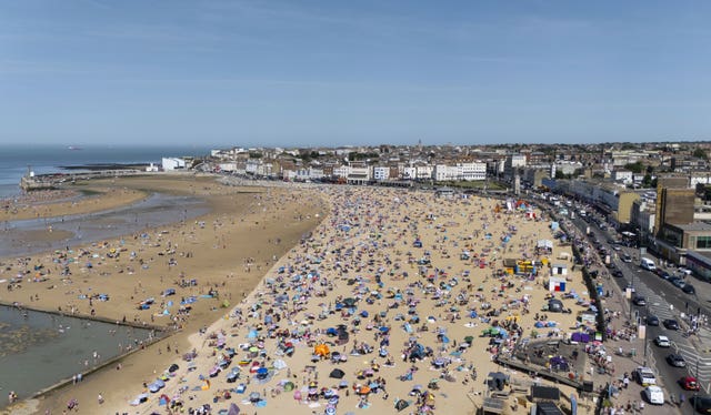 People enjoying the warm weather on the beach in Margate in Kent