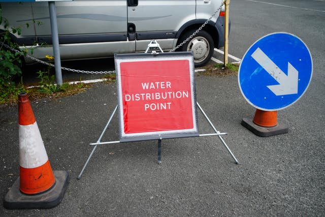 A sign advertising water distribution in Brixham, Devon 