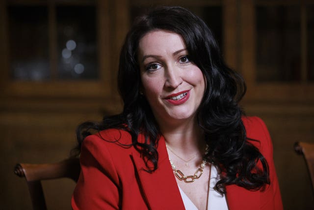 A close-up of Emma Little-Pengelly in a red jacket