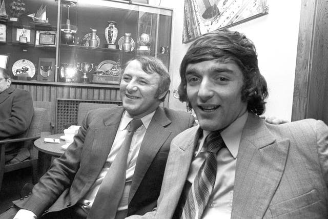 Docherty and Macari following his move from Celtic. They are pictured in Manchester after Macari had escaped injury in a car crash (PA Archive/PA Images)