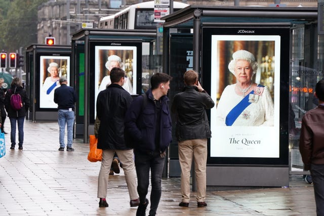 Tributes to Queen Elizabeth II on bus stops in Princes Street in Edinburgh