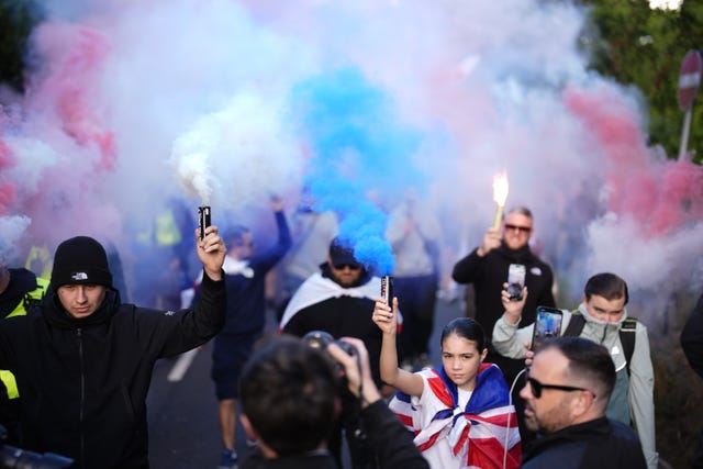 Protesters outside the Bell Hotel in Epping, Essex after a temporary injunction that would have blocked asylum seekers from being housed at the hotel, was overturned at the Court of Appeal