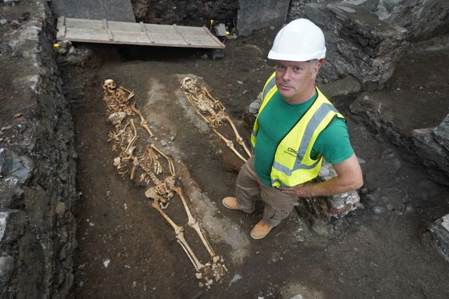 Edmond O’Donovan, director of excavations for Courtney Deery Heritage Consultancy, standing at an ancient burial site in 2023 which was discovered during preparatory works for a new development on Capel Street, Dublin 
