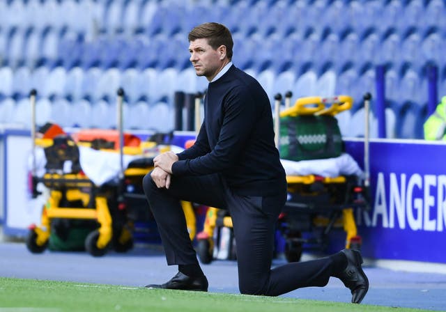 Rangers manager Steven Gerrard takes a knee ahead of the match against St MIrren