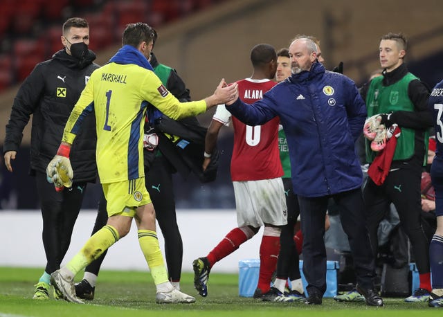 David Marshall, left, shakes hands with Steve Clarke after the draw with Austria