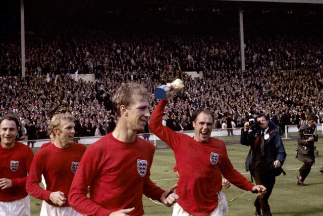 England’s George Cohen, Bobby Moore, Jack Charlton and Ray Wilson (with trophy) celebrate after winning the World Cup in 1966