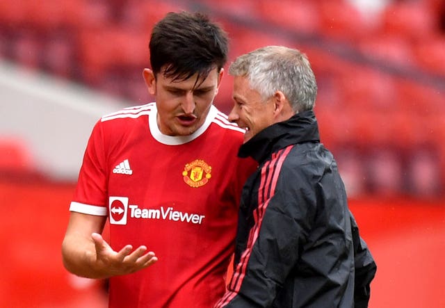Ole Gunnar Solskjaer and Harry Maguire file photo