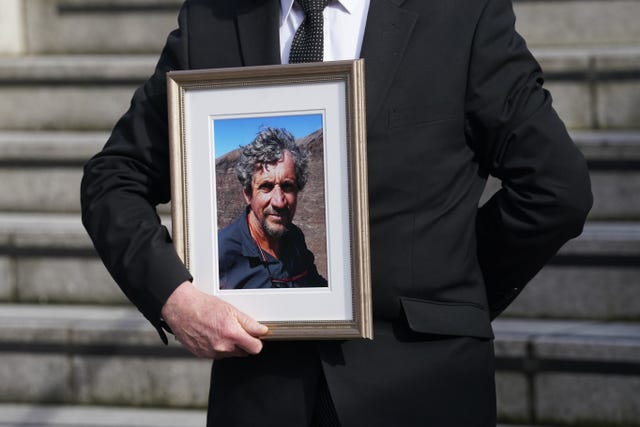 A man holds a photograph of Charlie Bird at a service at Mansion House in Dublin to celebrate the life of the former RTE correspondent